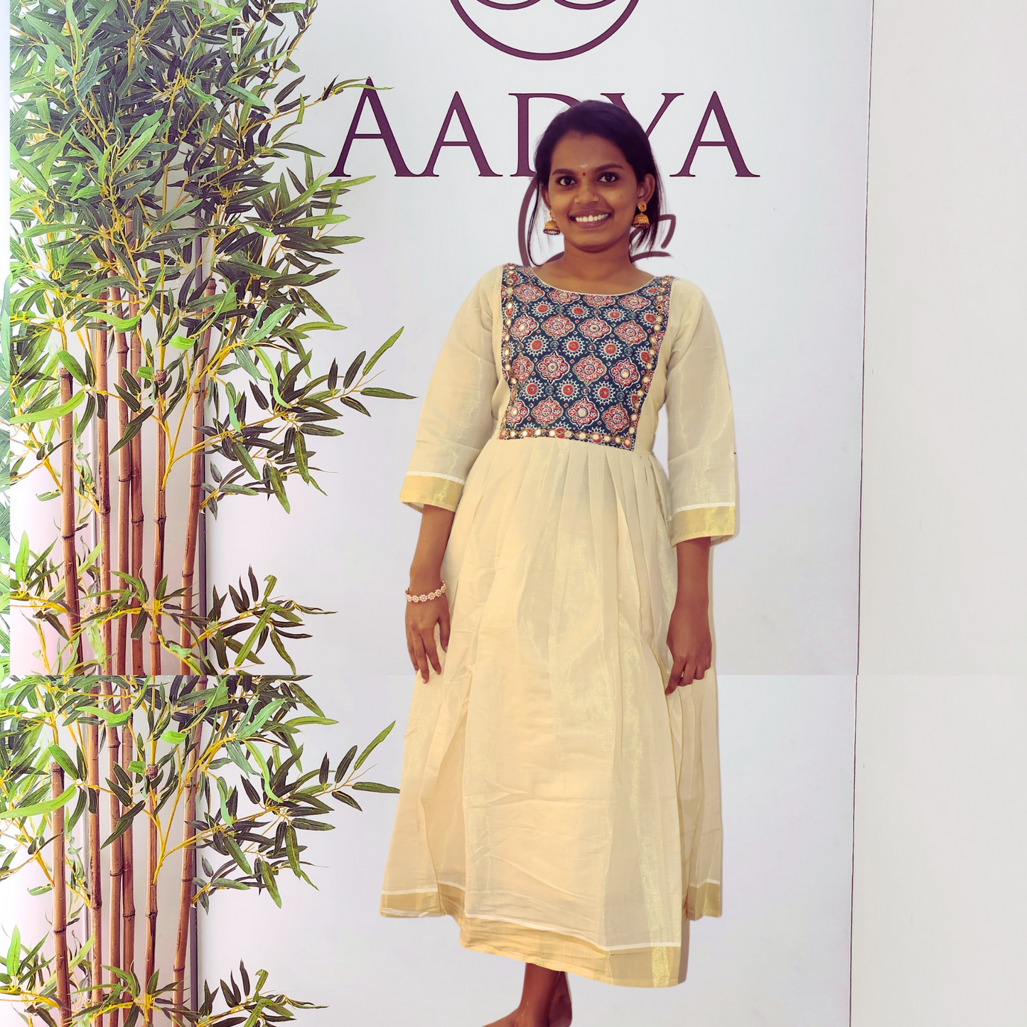 Golden Tissue Pleated Kurta with Contrast Color Blue Ajrakh Yoke with Mirrorwork