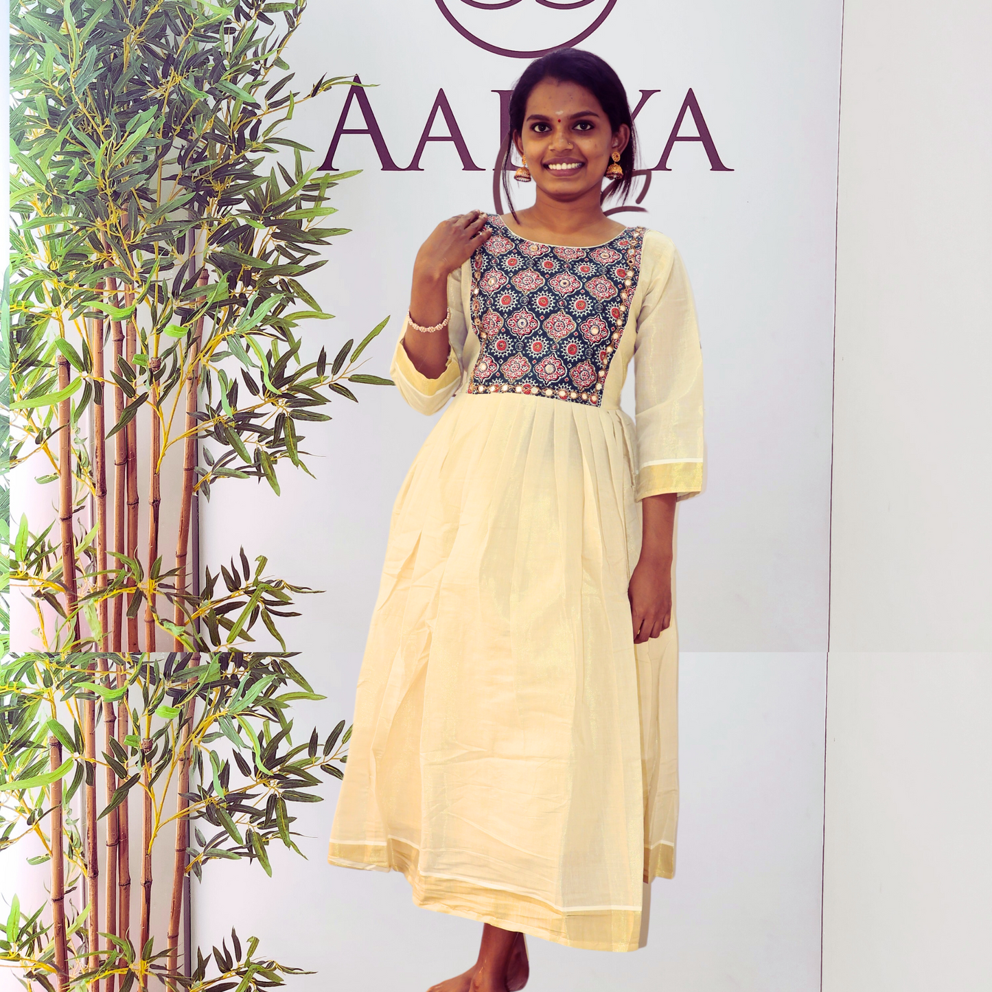 Golden Tissue Pleated Kurta with Contrast Color Blue Ajrakh Yoke with Mirrorwork