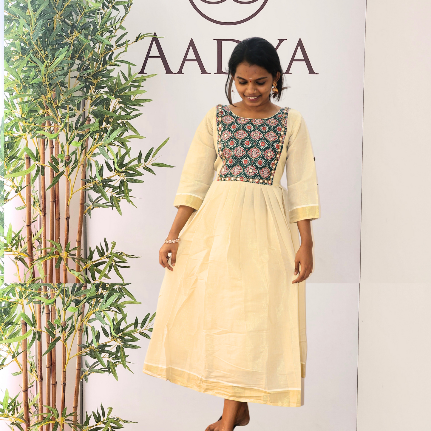 Golden Tissue Pleated Kurta with Contrast Color Blue Ajrakh Yoke with Mirrorwork
