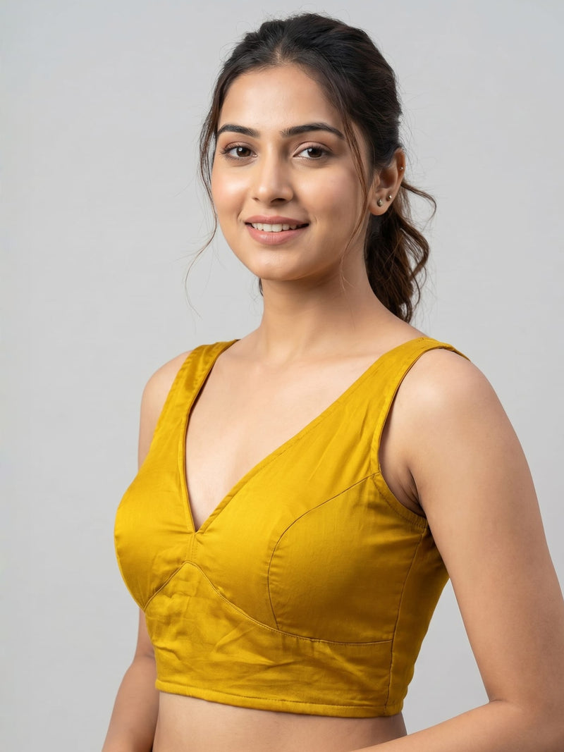 Mustard yellow cotton silk padded sleeveless saree blouse with deep back