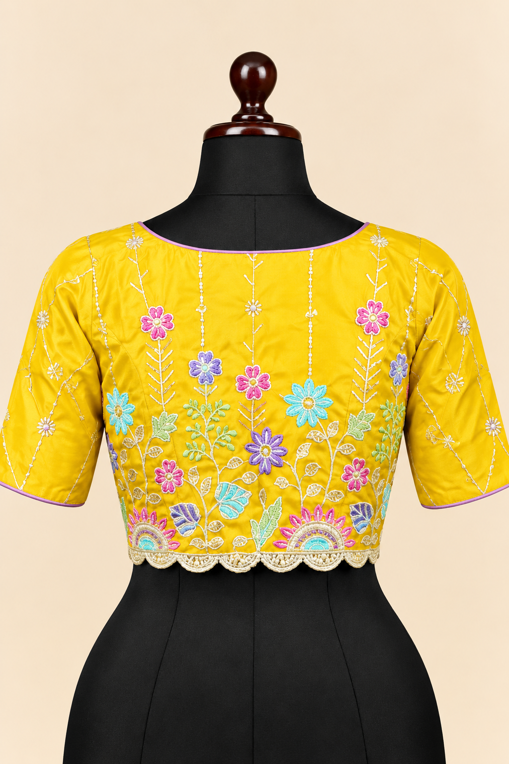 Yellow satin silk embroidered readymade blouse - back view with multicolour floral embroidery and scalloped hem